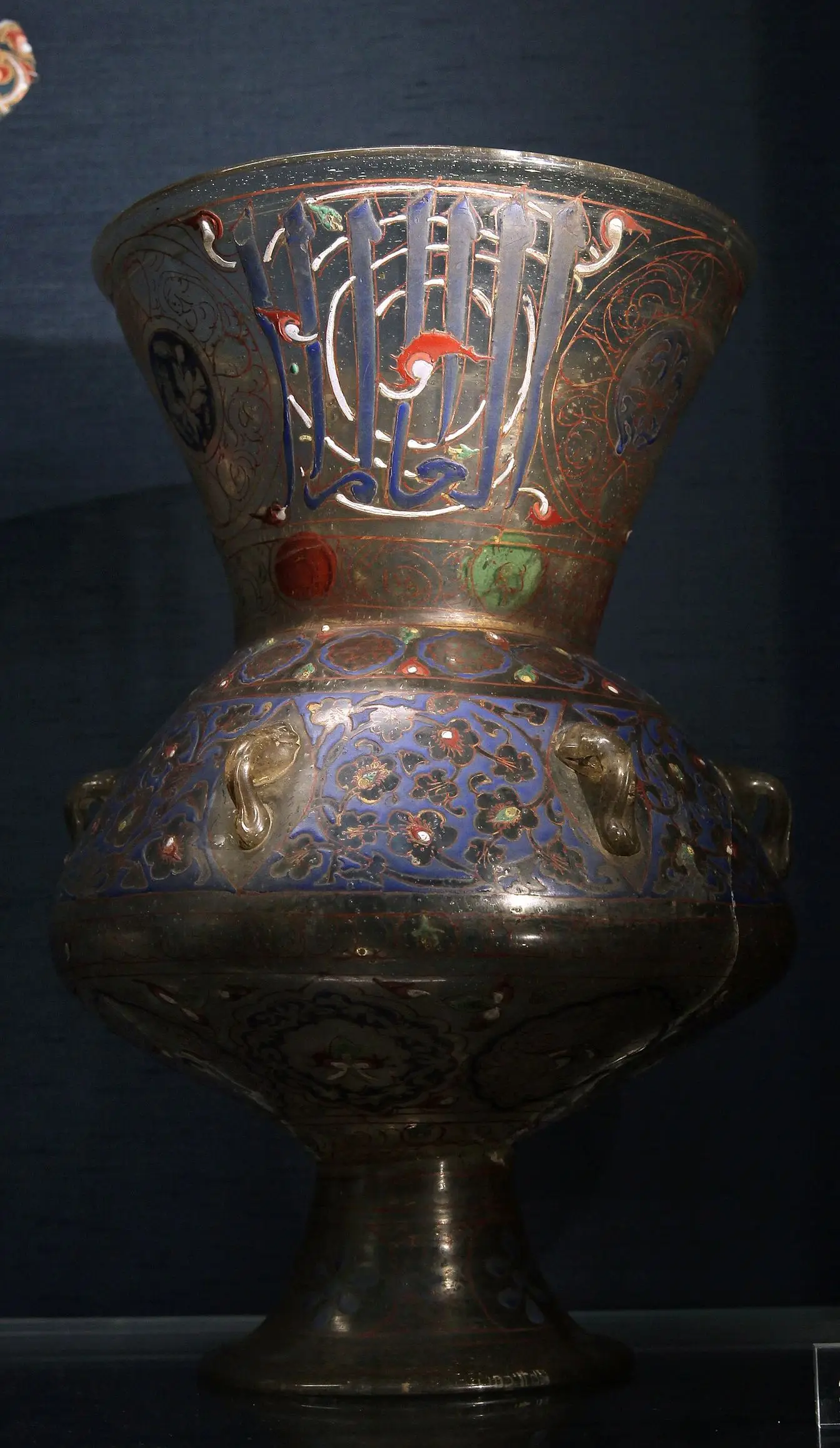 A Mamluk mosque lamp of enamelled and gilded glass, made in Syria or Egypt around 1360 and held by the British Museum. It is an example of the type described in this story, not the lamp in Hurghada's collection.