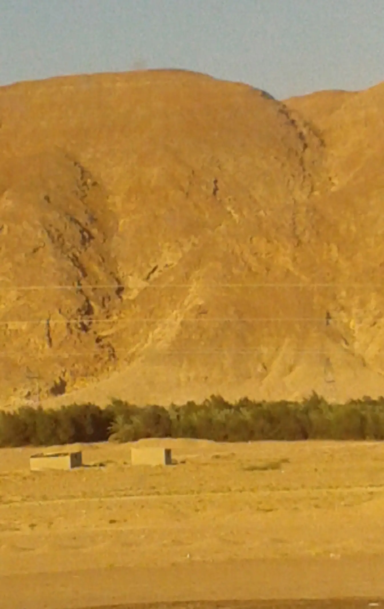 Red Sea mountains seen from the Cairo–Hurghada road, the desert catchment whose valleys carry run-off towards the coast.