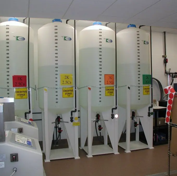 A central dialysate delivery system in a dialysis unit — a generic illustration of haemodialysis equipment, not the hospital in this report.