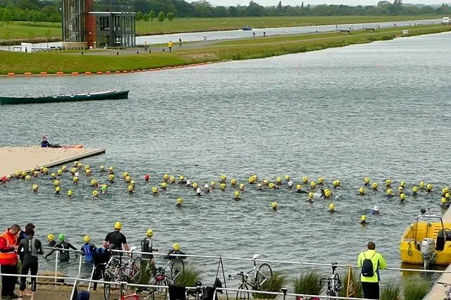 Competitors swimming the open-water leg of a triathlon. File photograph from another event, not from the Hurghada championships.