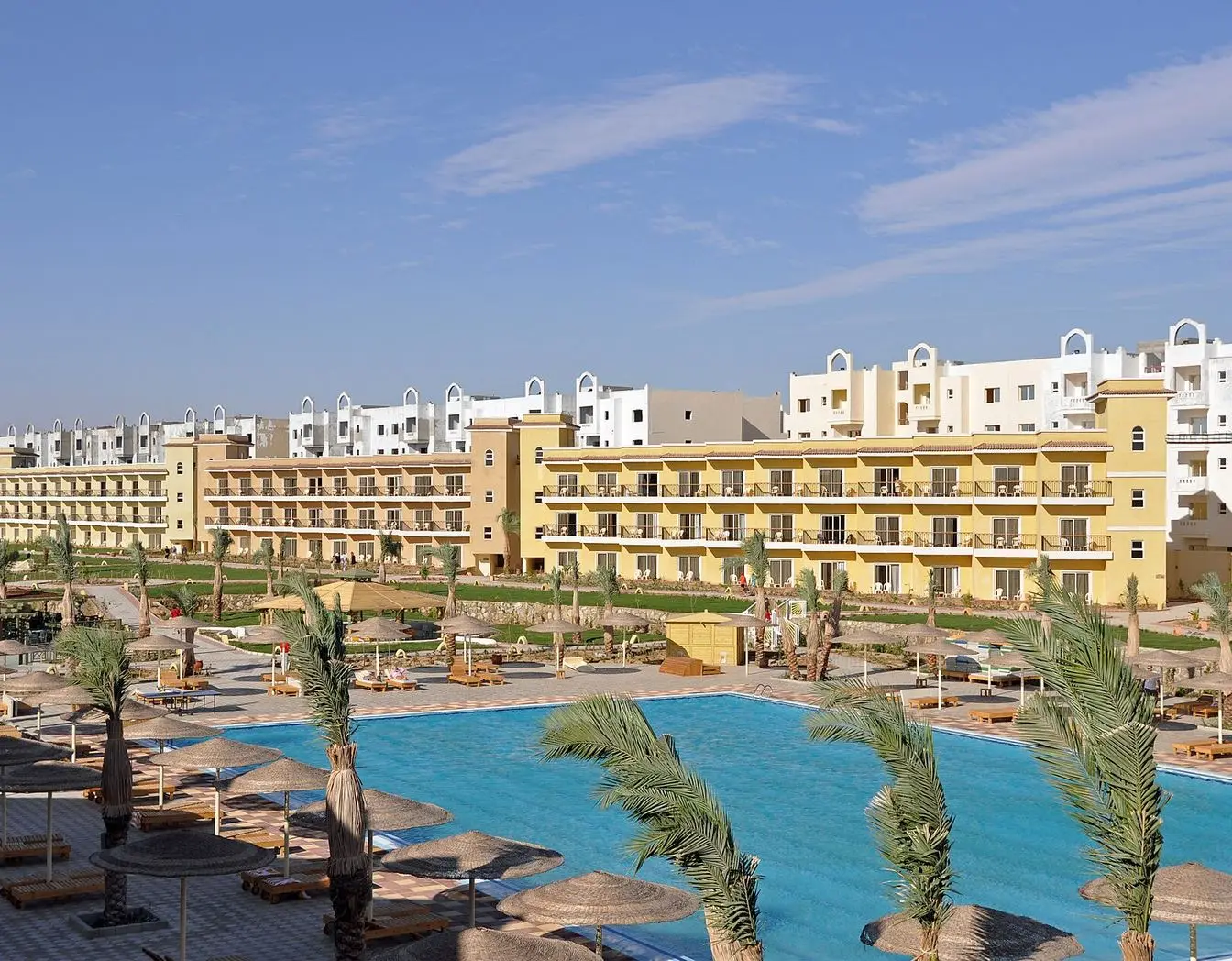 Sun loungers and parasols on the beach of a Hurghada hotel resort.