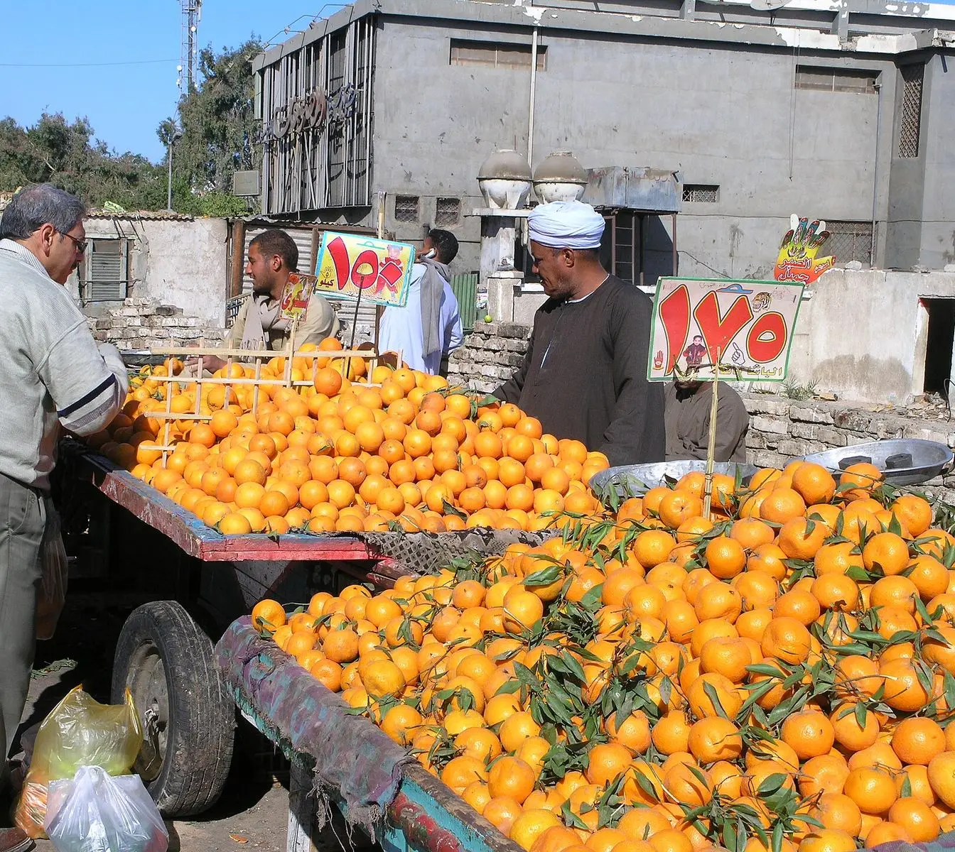 A produce stall with handwritten prices at a market in Hurghada. File photo; it does not show the shops covered by the inspection campaigns.