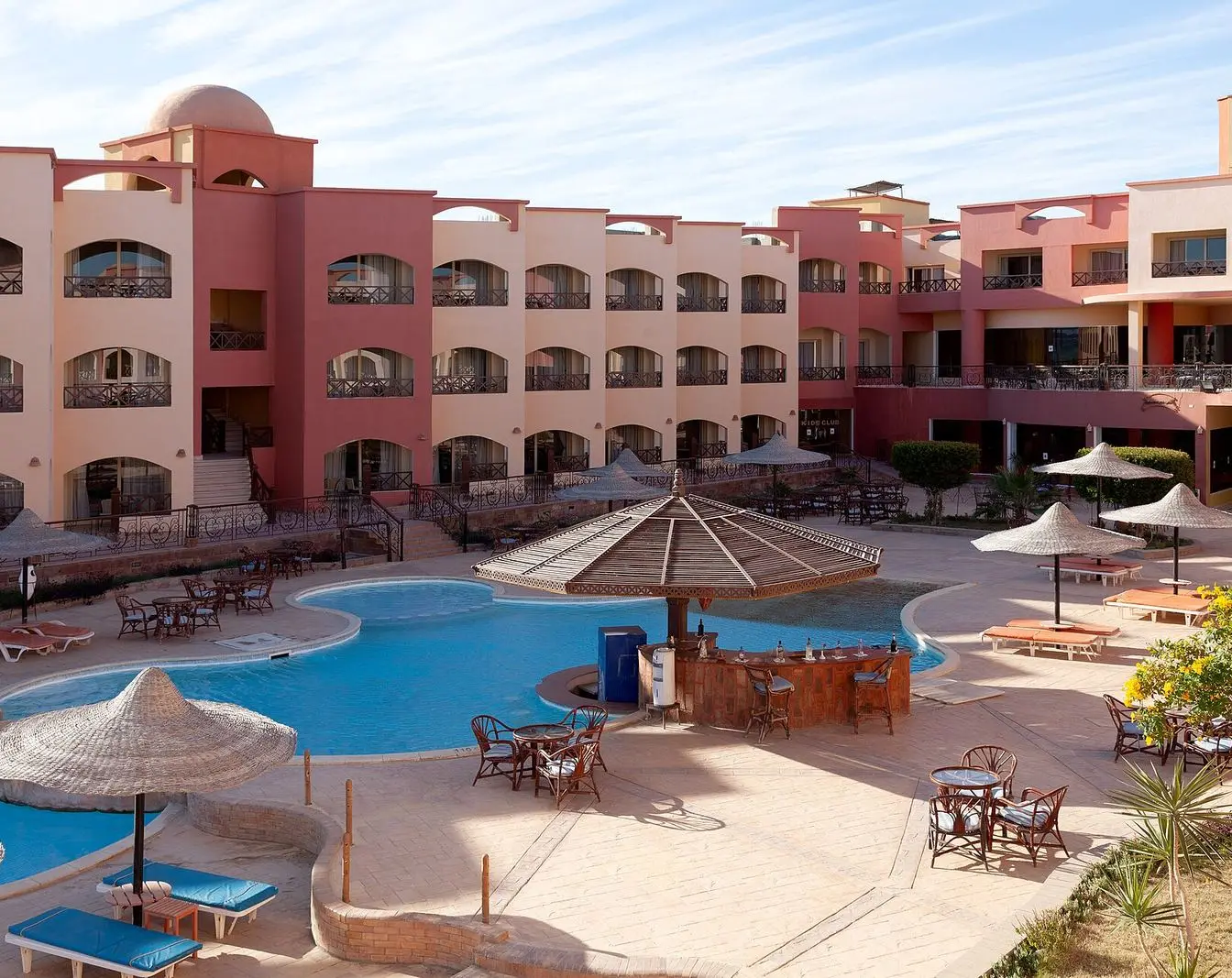 A hotel building and swimming pool at a resort in Marsa Alam, Egypt