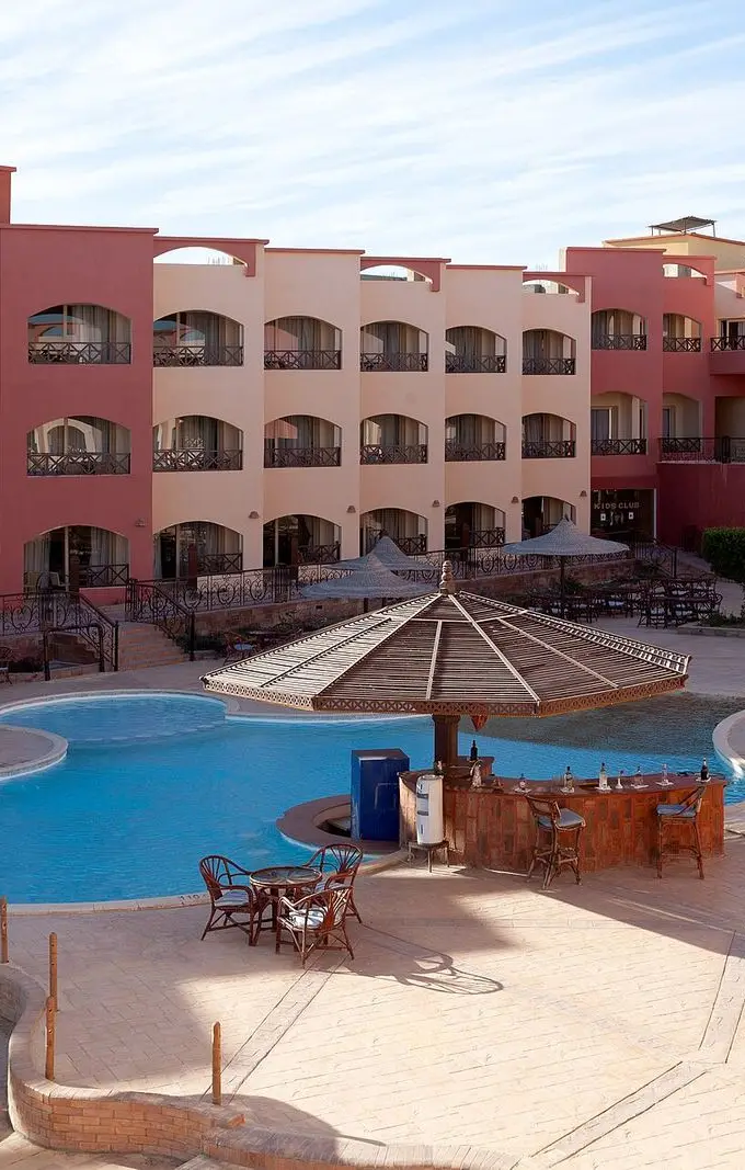 A hotel building and swimming pool at a resort in Marsa Alam, Egypt