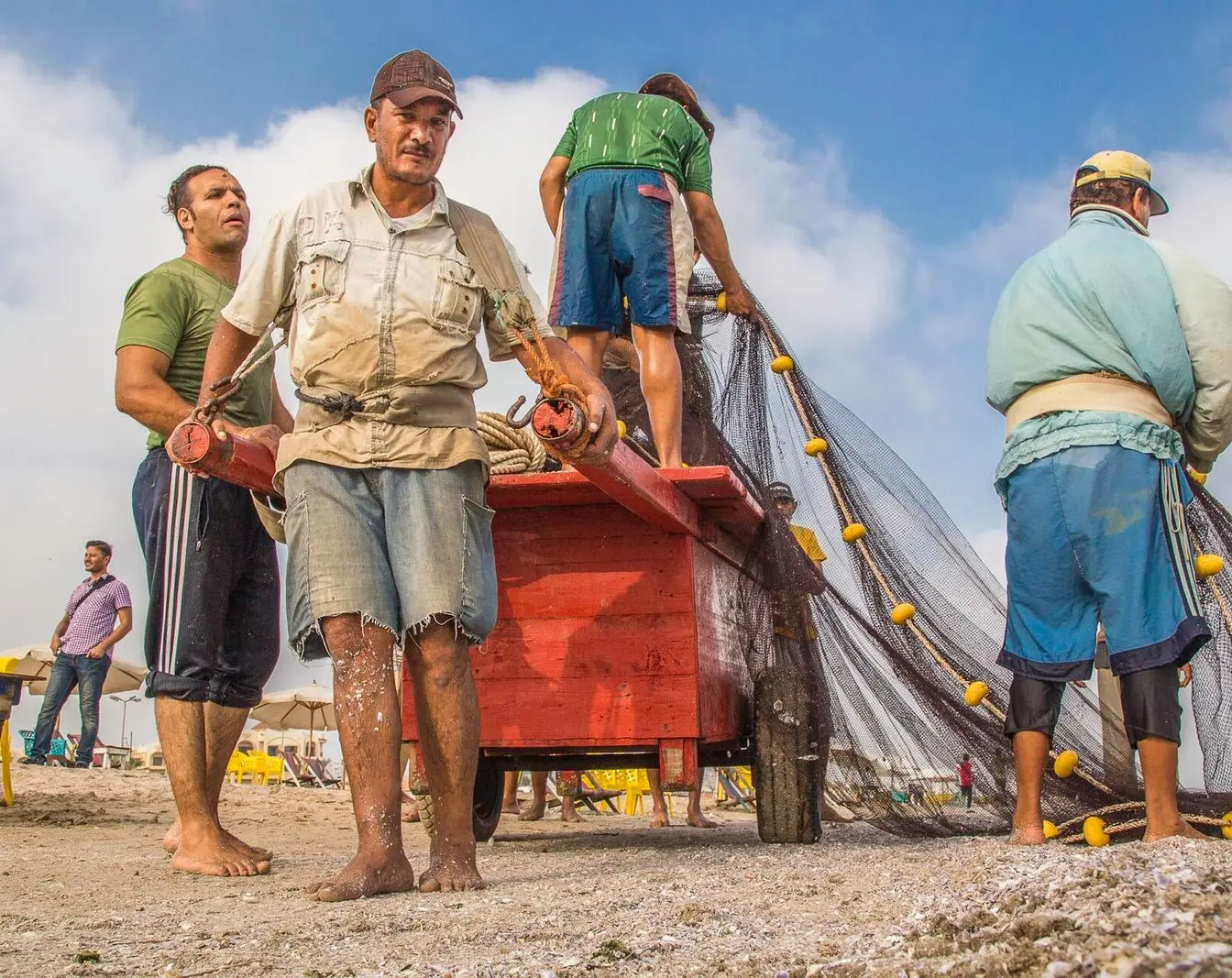 Fishermen pulling a net out of the sea in Egypt
