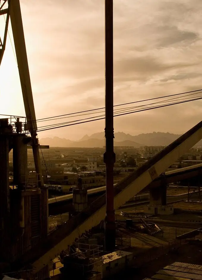 Cranes and cargo facilities at Safaga port at sunset