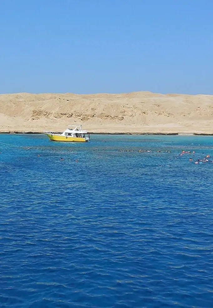 A boat trip on the Red Sea near Hurghada with calm blue water under a clear sky
