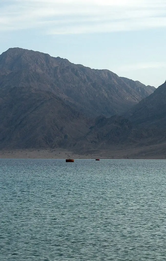 View of the Red Sea coast at Nuweiba, Sinai, with calm blue sea and mountains in the background