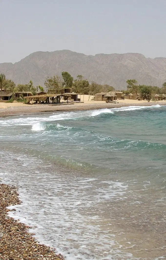 A quiet sandy beach on the Red Sea coast at Nuweiba, Sinai, Egypt, with calm blue water