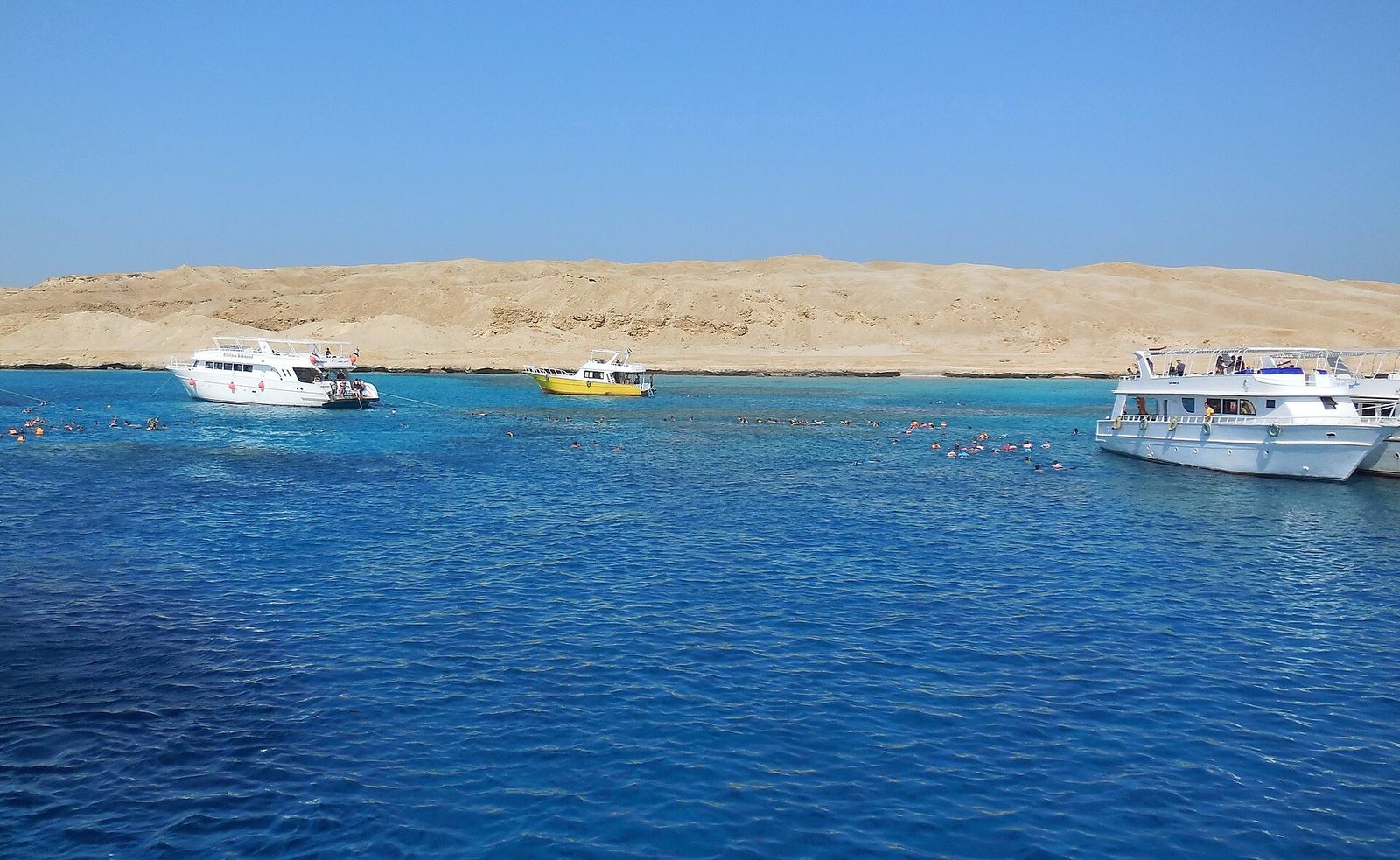 A boat trip on the Red Sea near Hurghada with calm blue water under a clear sky