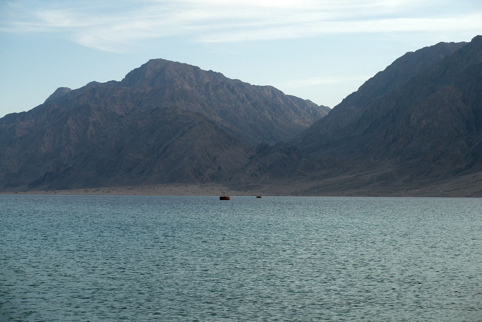 View of the Red Sea coast at Nuweiba, Sinai, with calm blue sea and mountains in the background
