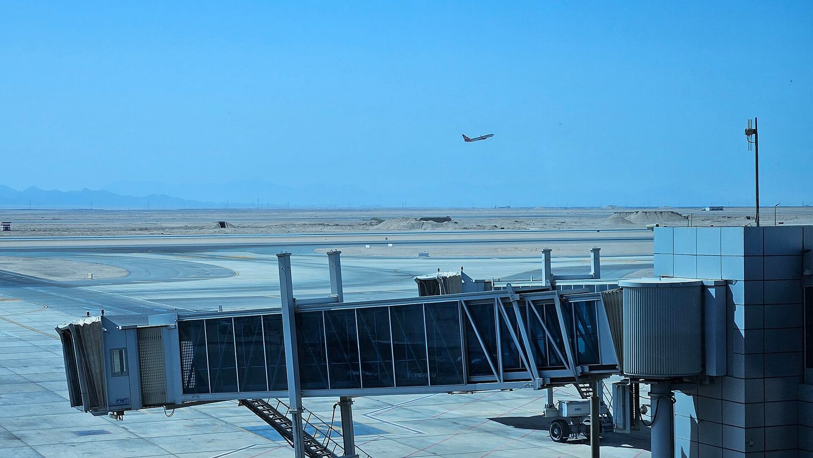 Exterior view of Hurghada International Airport terminal under a clear sky